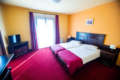 Postel nebo postele na pokoji v ubytování Hotel Clasic