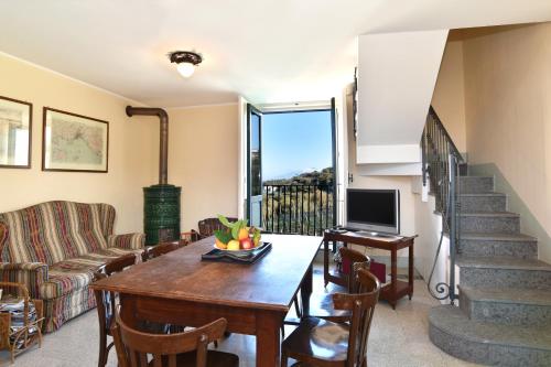 a living room with a table and a couch at La Ciucciara Holiday Homes in Massa Lubrense