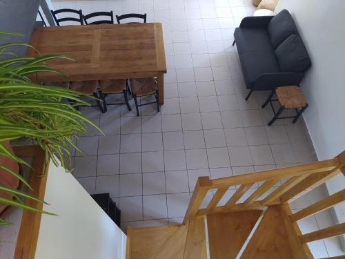 an overhead view of a living room with a couch and a table at La Maison du Chassezac in Les Assions