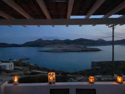 a view of a lake at night with candles at George's Traditional House in Agios Georgios