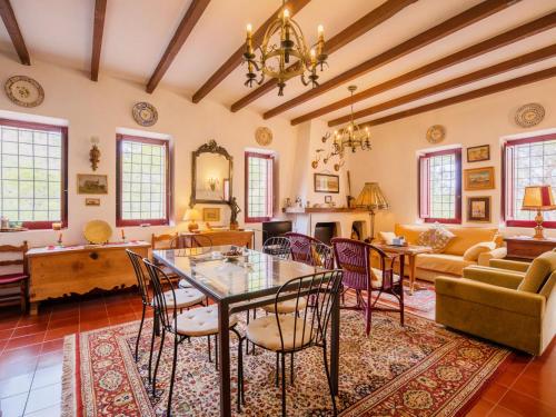 a living room with a table and chairs at Holiday Home De la Cruz by Interhome in Aledo