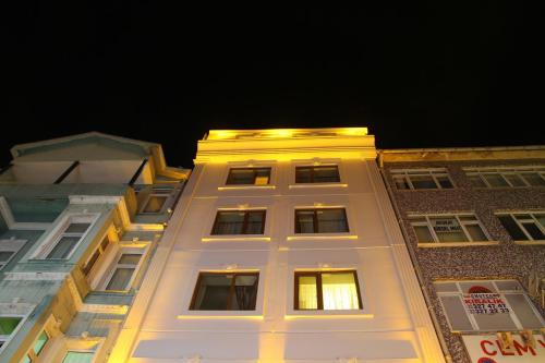 a white building with lights on top of it at Besiktas Otel in Istanbul