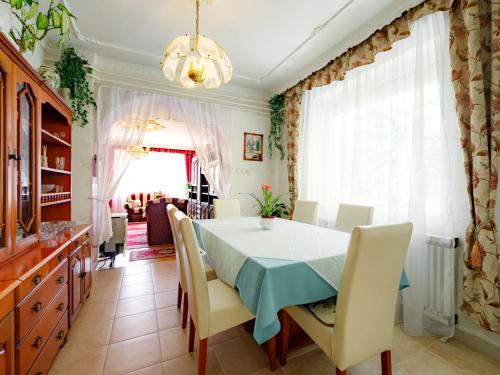a dining room with a table and chairs at Apartment Casablanca 1 by Interhome in Balatonszemes