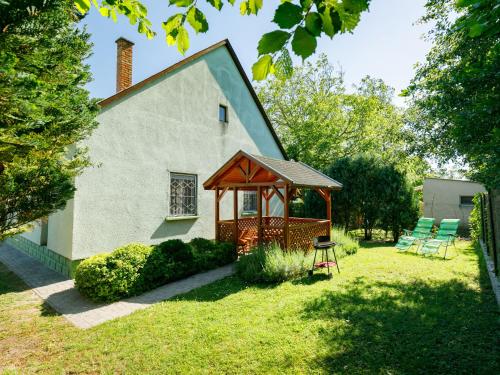 a house with a gazebo in the yard at Holiday Home Verde by Interhome in Balatonlelle