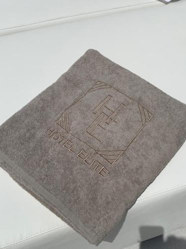 a book sitting on top of a white table at Hotel Elite in Varcaturo