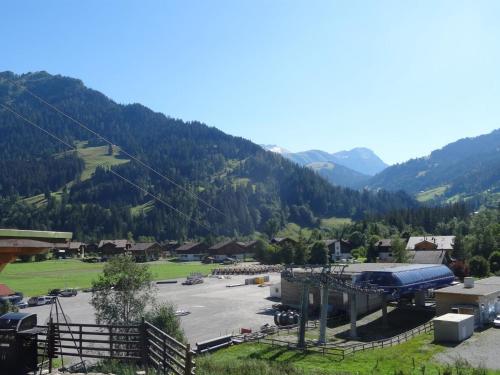 a view of a parking lot with mountains in the background at Apartment Kari's Schüür by Interhome in Lenk