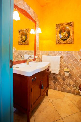 a bathroom with a sink and a mirror at Casale Villa Giulia Marina di Lesina in Lesina