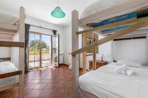 Säng eller sängar i ett rum på Boa Vida Guest House