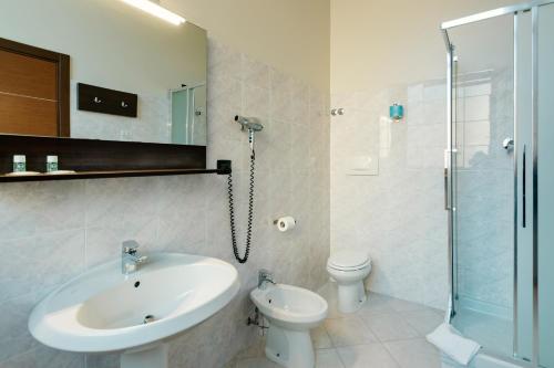 a bathroom with a sink and a toilet and a shower at B&B Hotel Roma Trastevere in Rome