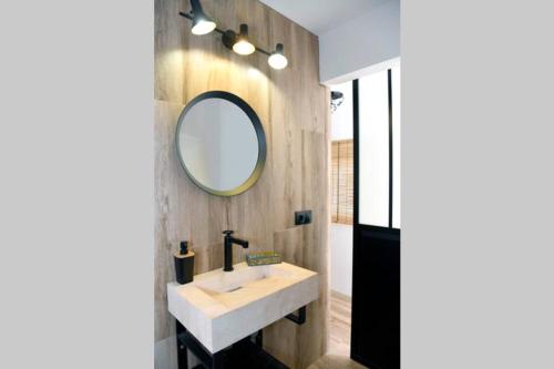 a bathroom with a sink and a mirror at La CaSita in Vara de Rey