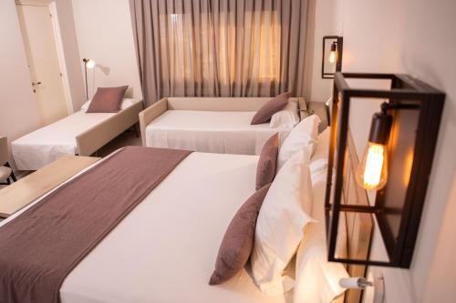 Кровать или кровати в номере RVHotels Broquetas Spa Termal