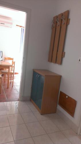 a cabinet sitting on the floor in a room at Apartments Sofija in Tivat