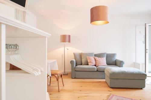 a living room with a couch and a chair at Domizil Gols, Studios Am Anger in Gols