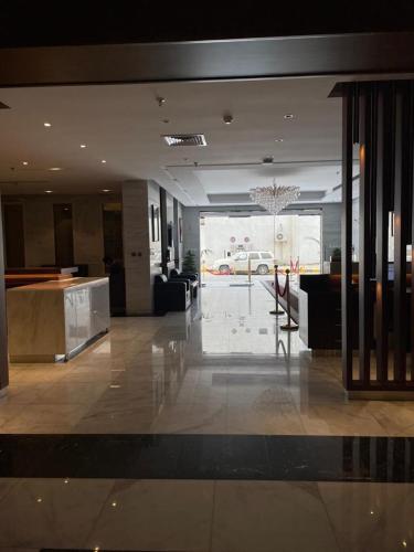 a lobby of a building with a car in the background at درة العروس للوحدات السكنية المفروشة in Jeddah