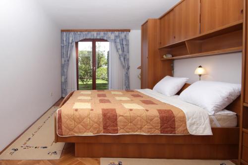 Posteľ alebo postele v izbe v ubytovaní Apartment Solman