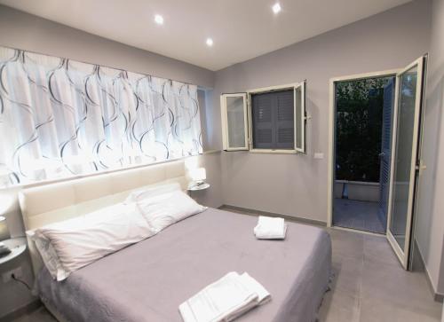 Postel nebo postele na pokoji v ubytování Montesanto Station