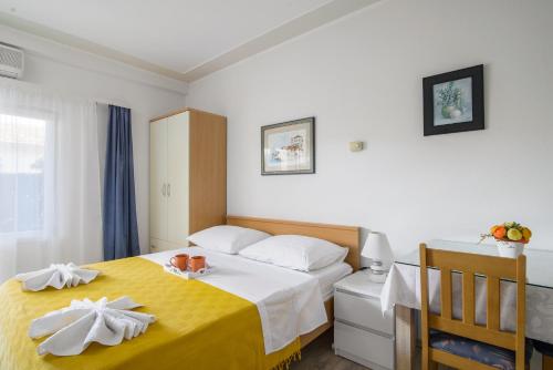 Ένα ή περισσότερα κρεβάτια σε δωμάτιο στο Apartments Kasalo