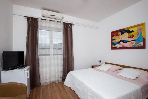 Ένα ή περισσότερα κρεβάτια σε δωμάτιο στο Villa Konalic