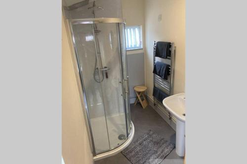 a bathroom with a shower and a sink at The Annex Keith Self Catering WiFi Private Parking bkng in Keith