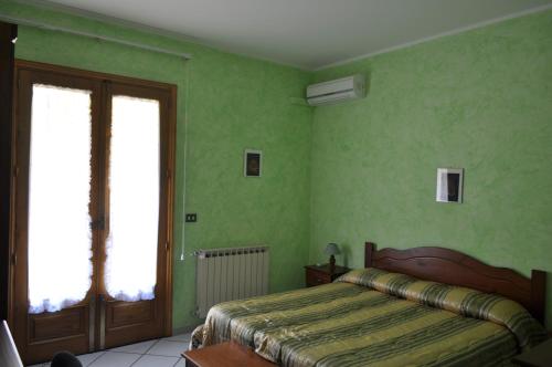 Postel nebo postele na pokoji v ubytování B&B Villa Dagala