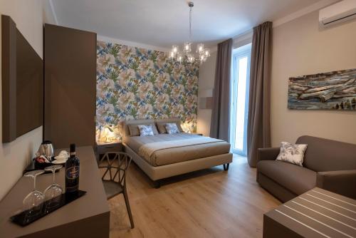 a living room with a bed and a couch at VILLA BERNASCONI in Narzole