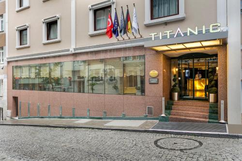 a front of a store with flags in front of it at Titanic Comfort Sisli in Istanbul