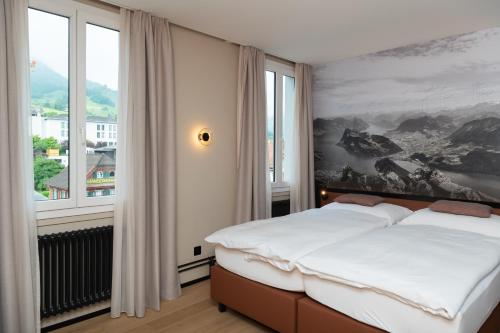 Postel nebo postele na pokoji v ubytování Boutique Hotel Stanserhof