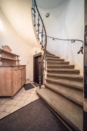 a staircase in a room with a stair case at St. George Apartments in Prague