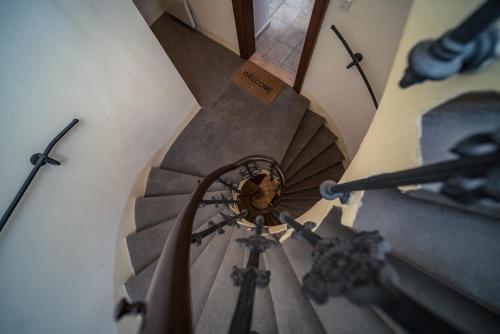 an overhead view of a spiral stairway with at St. George Apartments in Prague