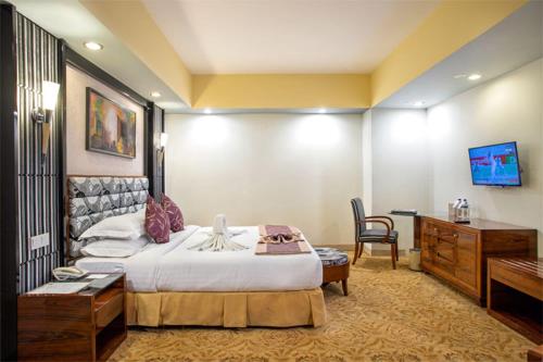 Ένα ή περισσότερα κρεβάτια σε δωμάτιο στο Hotel Star Pacific