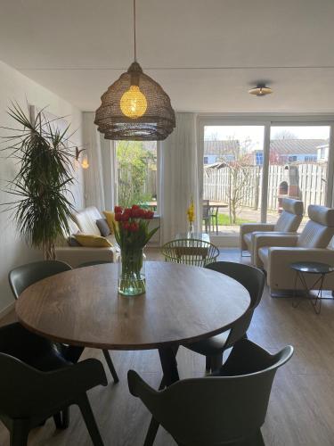 a living room with a table and chairs at Vakantiewoning in Middelburg Zeeland in Middelburg