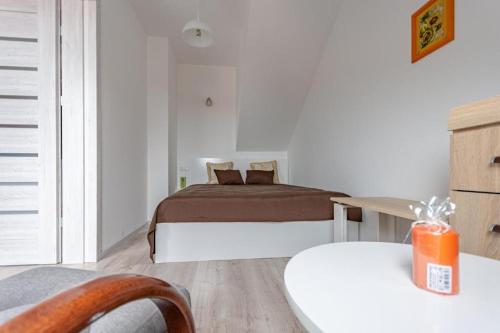 Ένα ή περισσότερα κρεβάτια σε δωμάτιο στο Apartament Kapitańska
