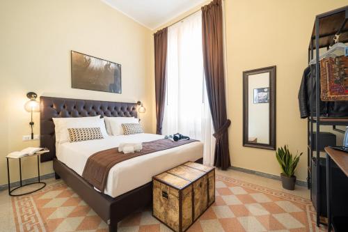 a bedroom with a large bed and a window at Sweet Home Pigneto Guest House in Rome