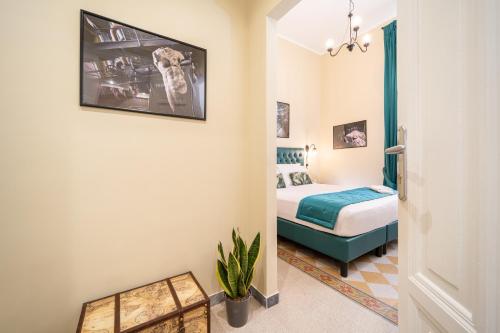 a hotel room with a bed and a hallway at Sweet Home Pigneto Guest House in Rome