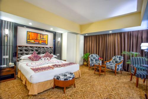 Ένα ή περισσότερα κρεβάτια σε δωμάτιο στο Hotel Star Pacific