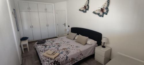 En eller flere senge i et værelse på Residence Marineda Playa Cabezo