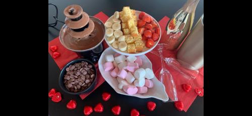 a table with a tray of different types of candy at Noxem b&b in Boesingheliede