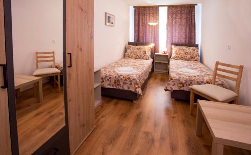 Ένα ή περισσότερα κρεβάτια σε δωμάτιο στο Apartman Lori