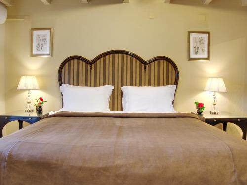 
Ένα ή περισσότερα κρεβάτια σε δωμάτιο στο Αίγλη Αράχωβα
