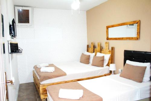 Postel nebo postele na pokoji v ubytování Viya Boutique Otel Alaçati