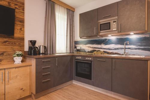 Кухня или мини-кухня в Hotel Apart Garni Heisenhof
