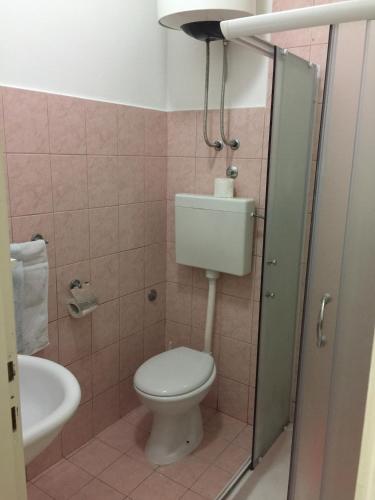 a bathroom with a toilet and a sink at Anita Guest House in Tivat
