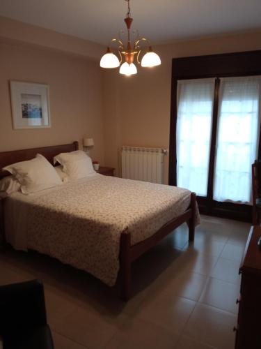 Ένα ή περισσότερα κρεβάτια σε δωμάτιο στο Hotel Arco Navia