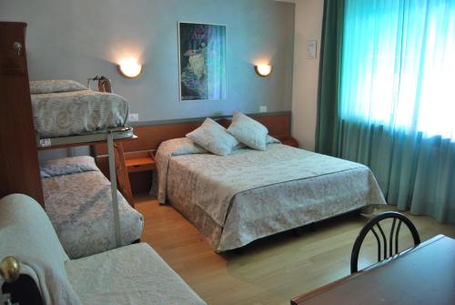 Postel nebo postele na pokoji v ubytování Villa Chiara