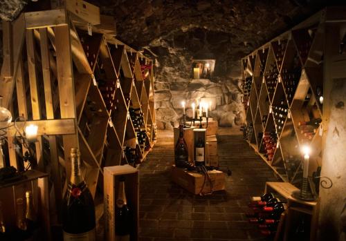 a wine cellar with a bunch of bottles of wine at Åkerblads Hotell Gästgiveri Spa in Tällberg