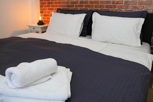 Ένα ή περισσότερα κρεβάτια σε δωμάτιο στο Apartman Relax