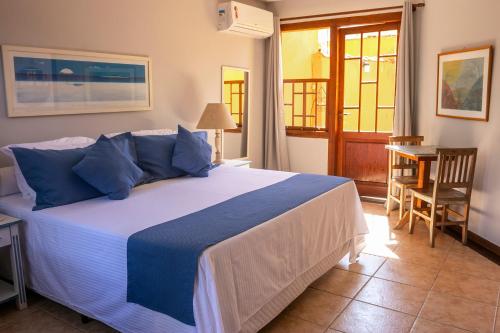 Cama ou camas em um quarto em Pousada das Pedras