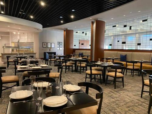 a dining room with tables and chairs at Hyatt Regency DFW International Airport in Dallas