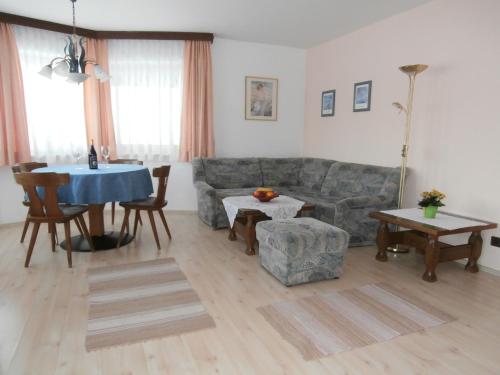 a living room with a couch and a table at Haus Sonja in Seefeld in Tirol