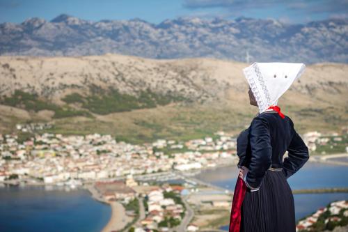 a woman wearing at Apartment Anamaria in Pag